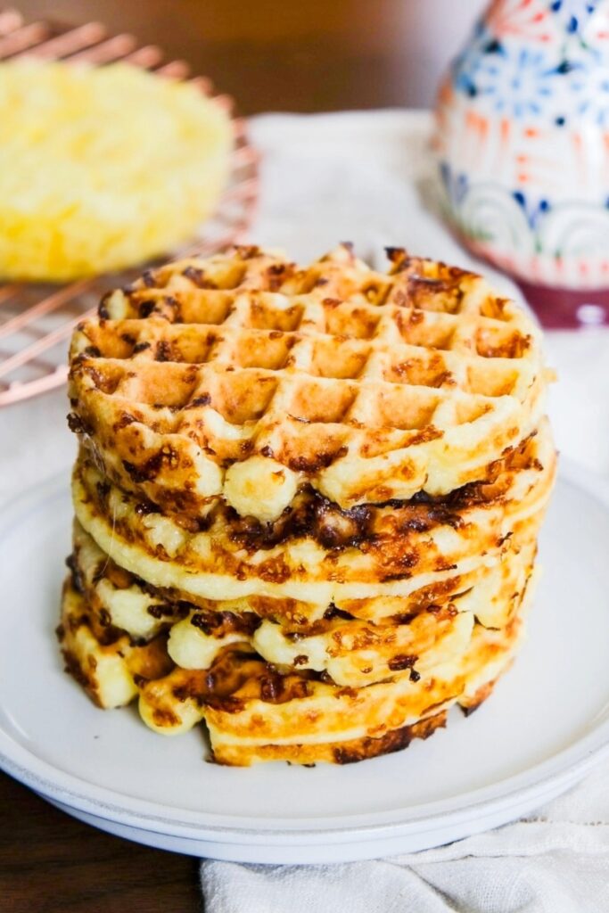 A stack of chaffles on a white plate.