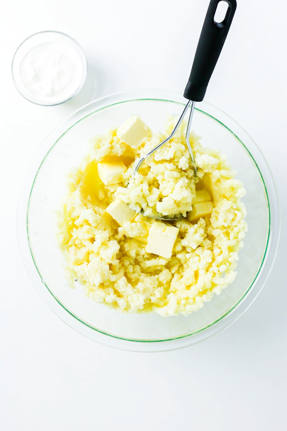 Cooked diced potatoes with butter.