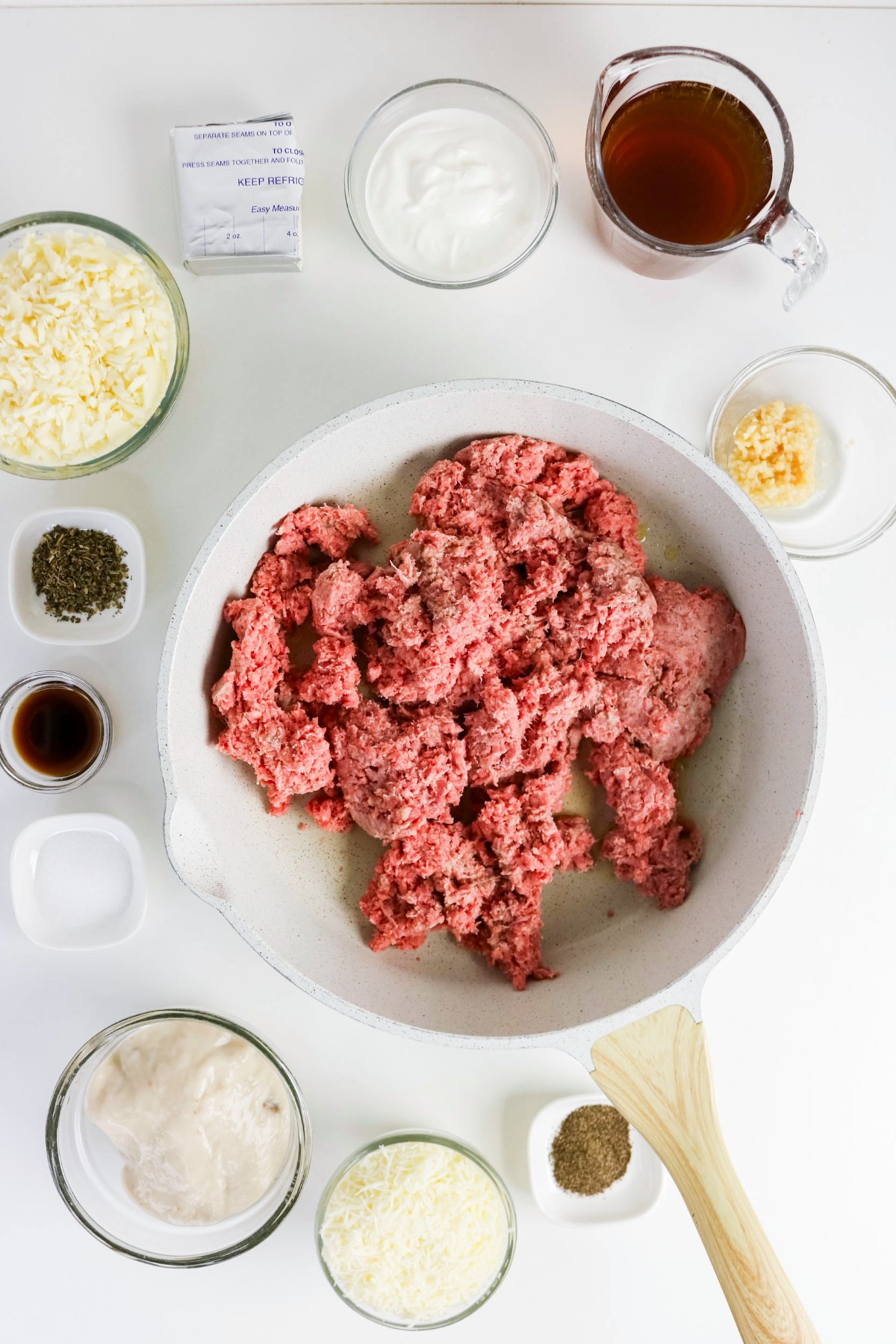 Ground beef in a skillet before cooking.