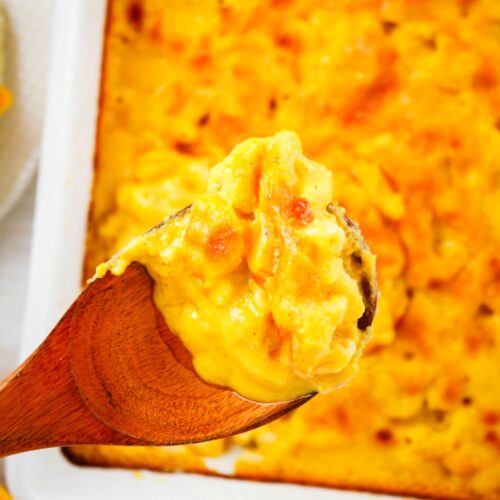 Macaroni and cheese made with butternut squash in a white baking dish.