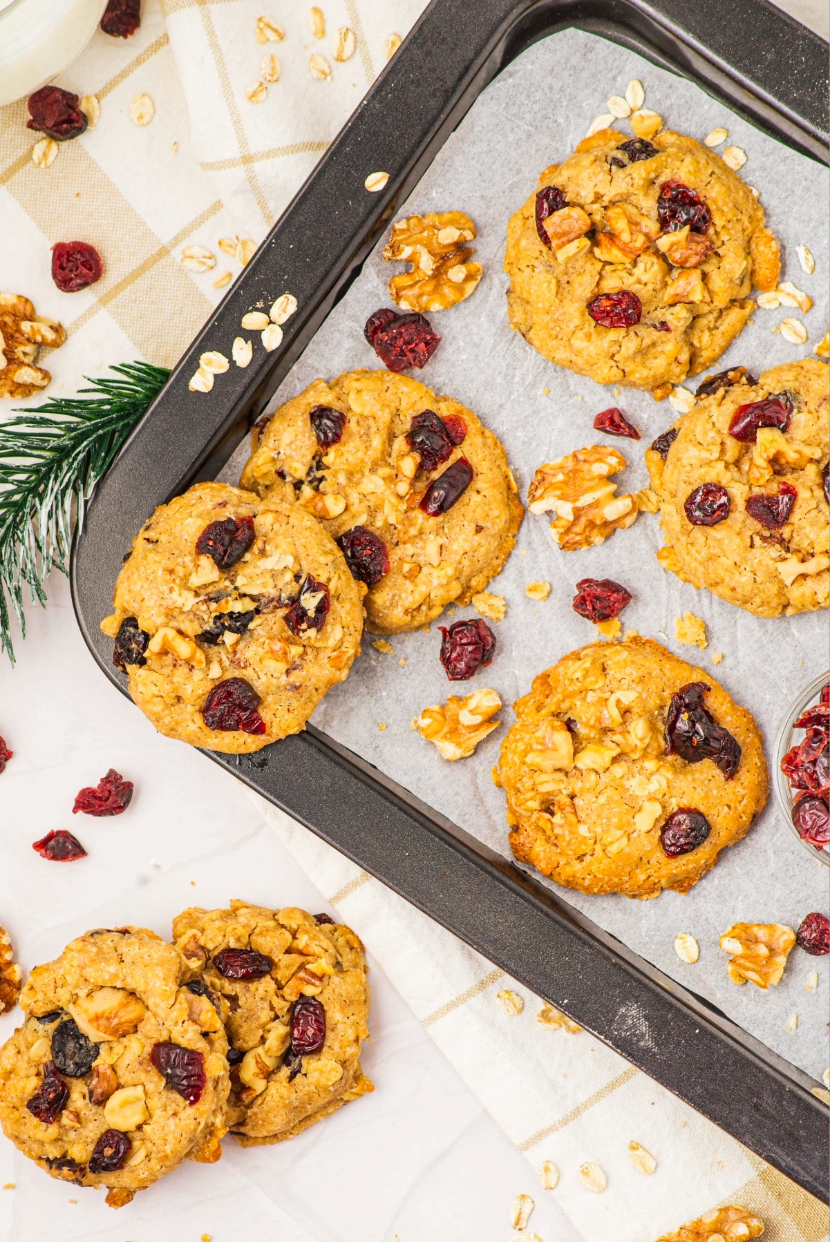 Overhead view of cookies on a baking sheet lined with parchment paper.